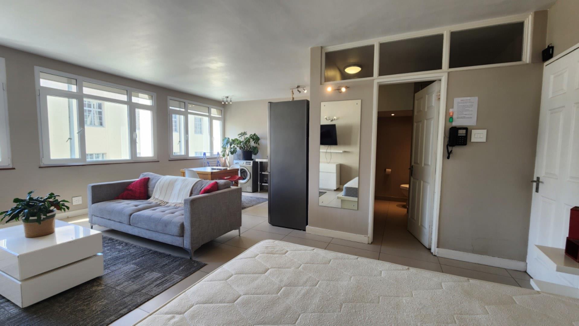 Fully furnished apartment with secure parking, laundry, and mountain