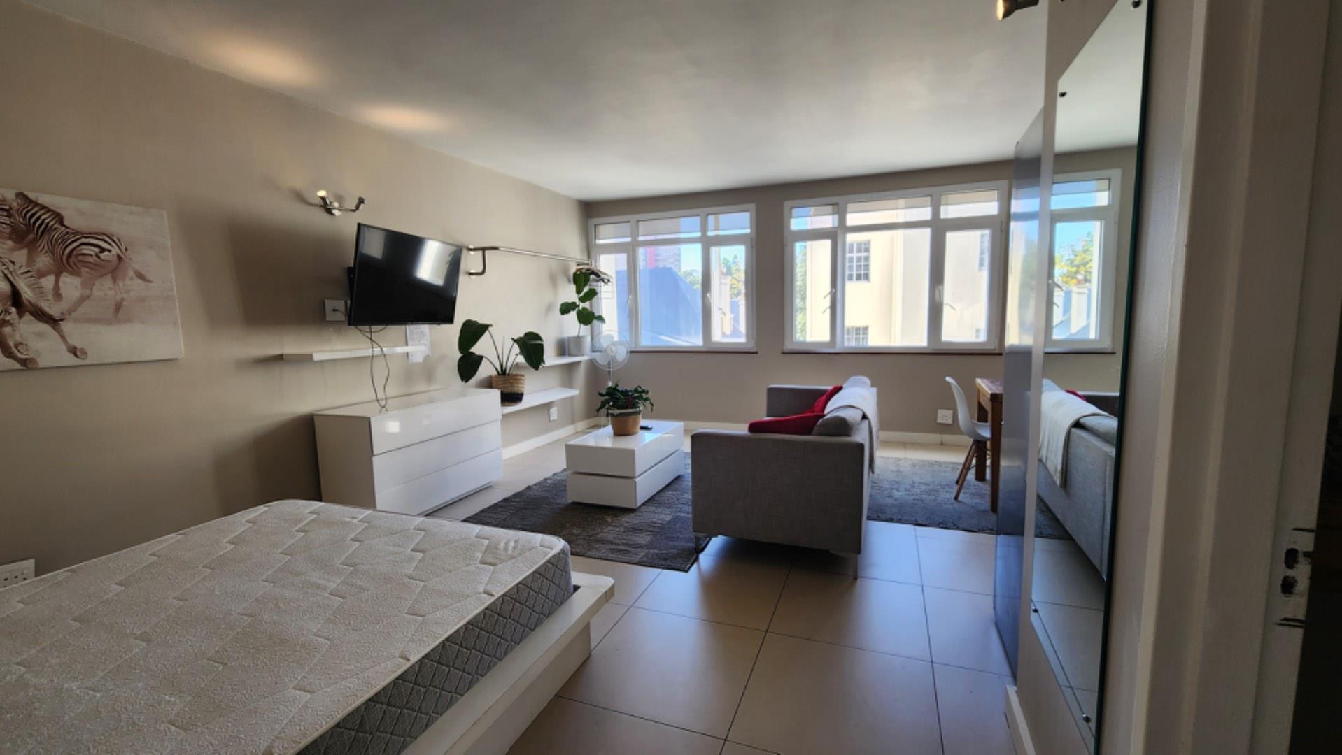 Fully furnished apartment with secure parking, laundry, and mountain