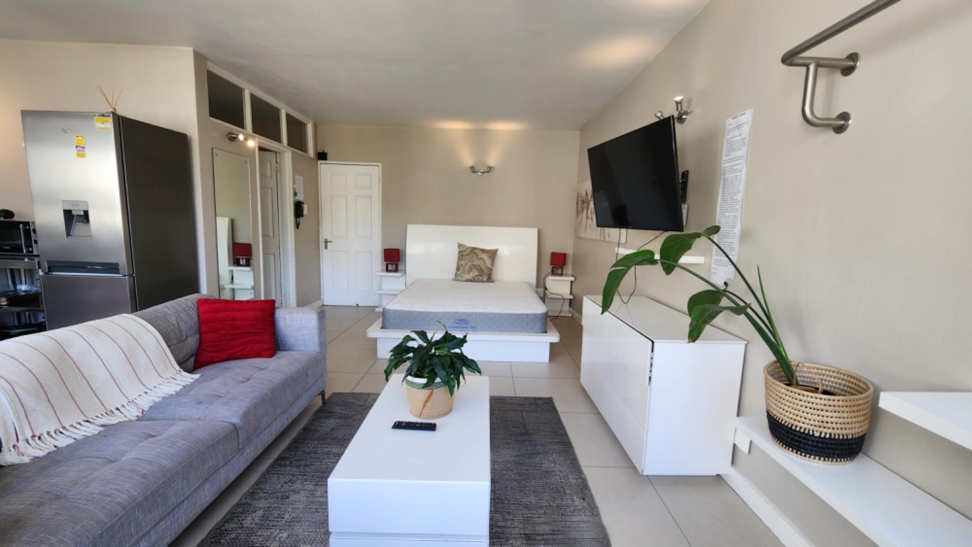 Fully furnished apartment with secure parking, laundry, and mountain